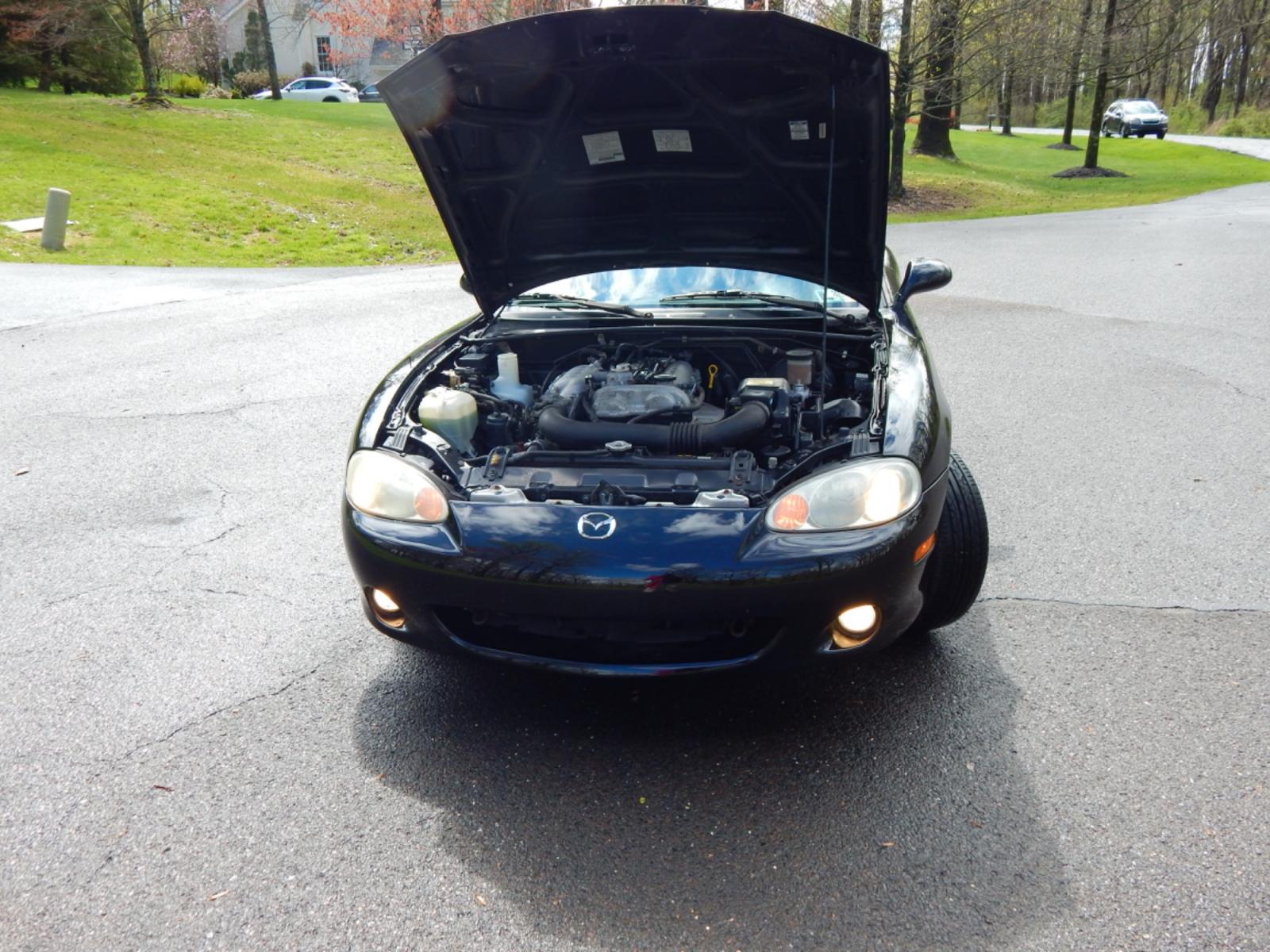2002 Black /Black Cloth Mazda MX-5 Miata base (JM1NB353920) with an 1.8 liter 4 cylinder engine, 5 speed manual transmission, located at 6528 Lower York Road, New Hope, PA, 18938, (215) 862-9555, 40.358707, -74.977882 - Here for sale is a very fun 2002 Mazda MX-5 Miata. Under the hood is a strong running 1.8 liter 4 cylinder which puts power to the rear wheels via a solid shifting 5 speed manual transmission. Features include; Black cloth interior, wood grain trim, cold AC, power windows, AM/FM/CD, heated rear wi - Photo #23